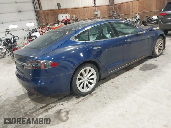 2018 Tesla Model S 75D with VIN 5YJSA1E24JF257817, listed as a IAAI auction lot 41960439 with 61,971 mi miles and . Bid and sale history available at DreamBid. Image 4.