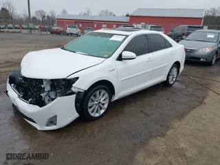 2014 Toyota Camry Hybrid LE with VIN 4T1BD1FK1EU102768, listed as a IAAI auction lot 41793746 with 157,015 mi miles. Bid and sale history available at carsss.com. Image 2.