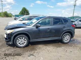 2015 Mazda CX-5 Touring with VIN JM3KE4CY9F0506879, listed as a IAAI auction lot 42209768 with 87,690 mi miles and . Bid and sale history available at DreamBid. Image 15.