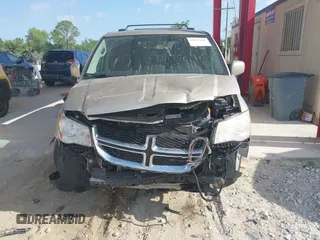 2014 Dodge Grand Caravan SXT with VIN 2C4RDGCG8ER244201, listed as a IAAI auction lot 42017091 with 161,653 mi miles and . Bid and sale history available at DreamBid. Image 6.