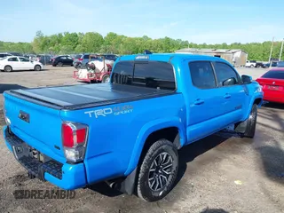 2021 Toyota Tacoma SR z VIN 3TYCZ5AN7MT008274, wystawiony jako IAAI lot #42091508 z przebiegiem 59 371 mil mil oraz . Historia ofert i sprzedaży dostępna na DreamBid. Obrazek 4.