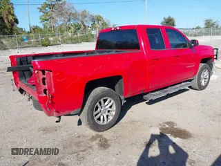 2018 Chevrolet Silverado 1500 LT with VIN 1GCRCREC1JZ170659, listed as a IAAI auction lot 41522588 with 129,412 mi miles and . Bid and sale history available at DreamBid. Image 4.