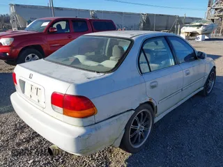1997 Honda Civic LX with VIN 1HGEJ6571VL028196, listed as a IAAI auction lot 41429128 with 398,114 mi miles. Bid and sale history available at carsss.com. Image 4.
