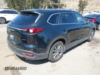 2020 Mazda CX-9 Sport with VIN JM3TCABY8L0407430, listed as a IAAI auction lot 42288490 with 50,317 mi miles and . Bid and sale history available at DreamBid. Image 4.