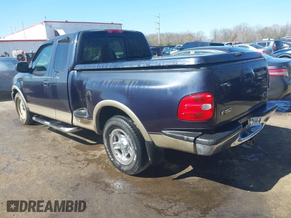 1999 Ford F-150 XL with VIN 2FTRX07L3XCA60067, listed as a IAAI auction lot 41887212 with 176,034 mi miles. Bid and sale history available at carsss.com. Image 3.