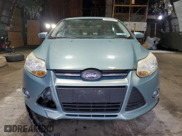 2012 Ford Focus SE with VIN 1FAHP3F27CL149328, listed as a Copart auction lot 56000325 with 147,097 mi miles and Salvage Title. Bid and sale history available at DreamBid. Image 5.