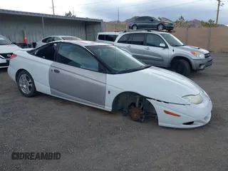2002 Saturn SC with VIN 1G8ZR12762Z212309, listed as a IAAI auction lot 41857740 with 204,209 mi miles. Bid and sale history available at carsss.com. Image 1.