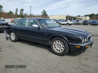 2002 Jaguar XJ 8 with VIN SAJDA14C62LF40435, listed as a Copart auction lot 52022645 with 153,703 mi miles and Salvage title. Bid and sale history available at DreamBid. Image 4.