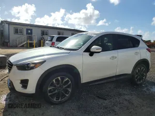 2016 Mazda CX-5 Grand Touring z VIN JM3KE2DY5G0722572, wystawiony jako Copart lot #47657885 z przebiegiem 112 653 mil mil oraz Czysty tytuł • Clean title. Historia ofert i sprzedaży dostępna na DreamBid. Obrazek 1.
