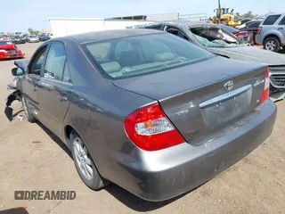 2004 Toyota Camry LE with VIN 4T1BF30K24U569209, listed as a IAAI auction lot 41988665 with 191,017 mi miles. Bid and sale history available at carsss.com. Image 3.