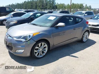 2012 Hyundai Veloster w/Black Int with VIN KMHTC6AD5CU030788, listed as a IAAI auction lot 42774337 with 104,297 mi miles and . Bid and sale history available at DreamBid. Image 2.