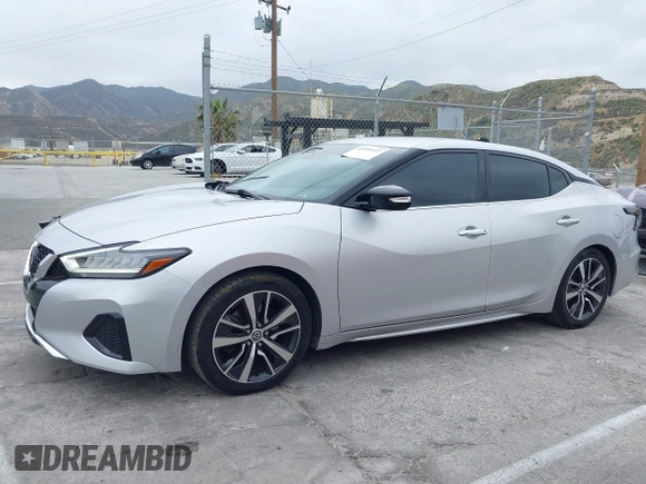 2020 Nissan Maxima SV with VIN 1N4AA6CVXLC380646, listed as a IAAI auction lot 42041422 with 99,579 mi miles and . Bid and sale history available at DreamBid. Image 14.