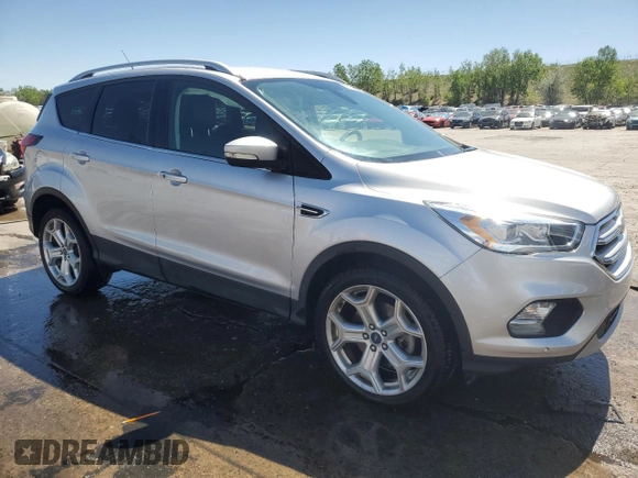 2019 Ford Escape Titanium с VIN 1FMCU9J90KUB85595, выставлен на аукционе Copart как лот 57410045 с пробегом 47 995 миль миль и Списание • Salvage title. История ставок и продаж доступна на DreamBid. Изображение 4.