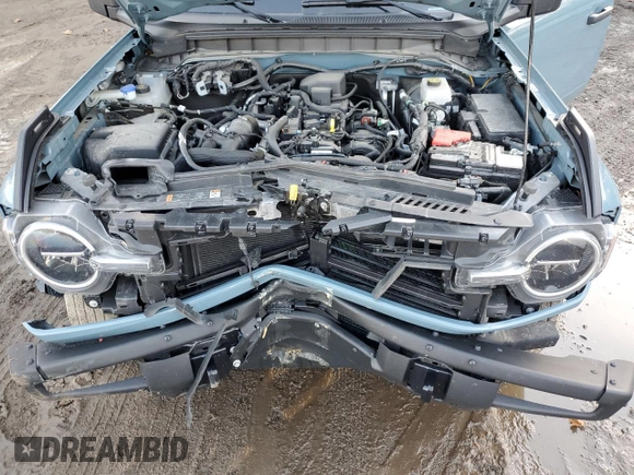 2022 Ford Bronco z VIN 1FMDE5AH6NLB71051, wystawiony jako Copart lot #77580794 z przebiegiem 20 904 mil mil oraz Szkoda całkowita • Salvage title. Historia ofert i sprzedaży dostępna na DreamBid. Obrazek 13.