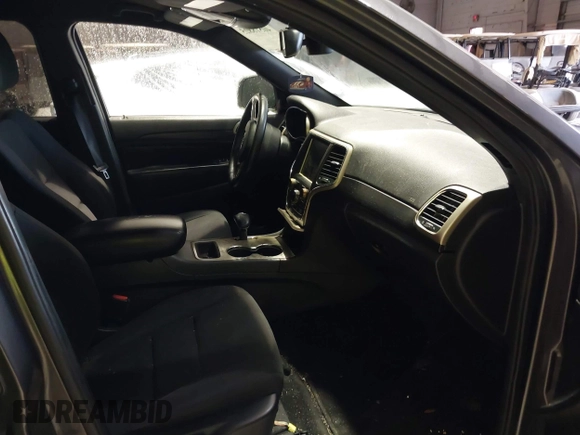2014 Jeep Grand Cherokee Laredo with VIN 1C4RJEAG7EC145023, listed as a IAAI auction lot 40518825 with 115,098 mi miles and . Bid and sale history available at DreamBid. Image 5.