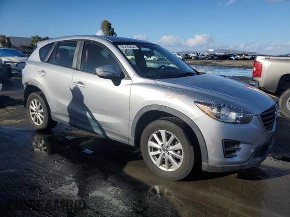 2016 Mazda CX-5 Sport with VIN JM3KE2BEXG0904597, listed as a Copart auction lot 86293834 with 63,343 mi miles and Salvage Title. Bid and sale history available at carsss.com. Image 4.