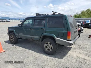 1999 Jeep Cherokee Sport with VIN 1J4FF68S2XL570795, listed as a Copart auction lot 61860585 with 320,467 mi miles and Salvage title. Bid and sale history available at DreamBid. Image 2.