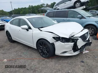 2016 Mazda Mazda6 i Grand Touring with VIN JM1GJ1W50G1456282, listed as a IAAI auction lot 40399372 with 162,388 mi miles. Bid and sale history available at carsss.com. Image 1.