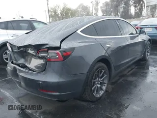 2018 Tesla Model 3 Long Range Battery with VIN 5YJ3E1EB1JF149423, listed as a IAAI auction lot 41896090 with 158,787 mi miles and . Bid and sale history available at DreamBid. Image 4.