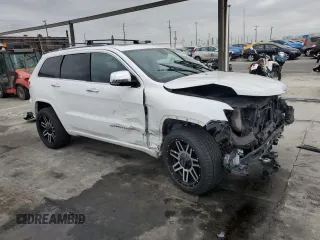 2015 Jeep Grand Cherokee Overland with VIN 1C4RJECG7FC872175, listed as a Copart auction lot 50653205 with 117,433 mi miles and Salvage title. Bid and sale history available at DreamBid. Image 4.