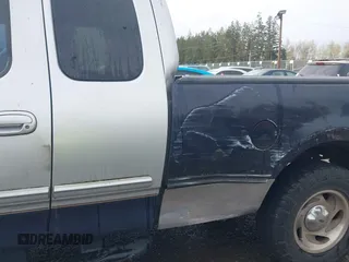 2000 Ford F-150 XL z VIN 1FTRX18L8YKA72409, wystawiony jako IAAI lot #41928360 z przebiegiem 167 251 mil mil oraz . Historia ofert i sprzedaży dostępna na DreamBid. Obrazek 6.