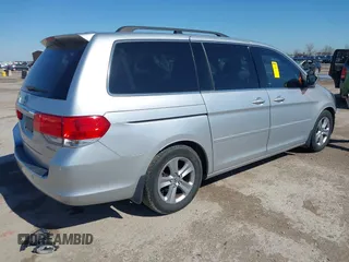 2010 Honda Odyssey Touring with VIN 5FNRL3H97AB015472, listed as a IAAI auction lot 41763680 with 144,309 mi miles. Bid and sale history available at carsss.com. Image 4.
