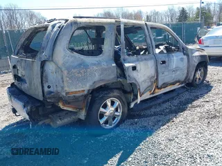 2006 GMC Envoy SLT with VIN 1GKDT13SX62323601, listed as a IAAI auction lot 41833523 with 1 mi miles. Bid and sale history available at carsss.com. Image 4.