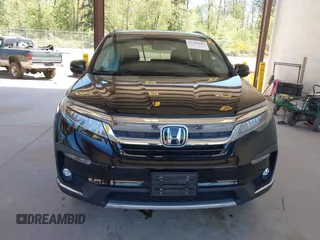 2021 Honda Pilot Touring 8-Passenger z VIN 5FNYF6H99MB049728, wystawiony jako IAAI lot #42194602 z przebiegiem 41 374 mil mil oraz . Historia ofert i sprzedaży dostępna na DreamBid. Obrazek 13.