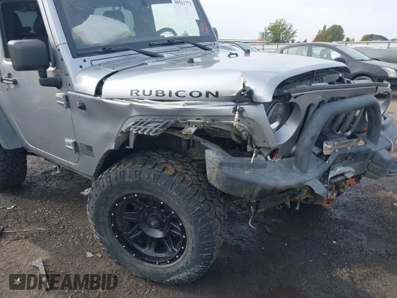 2013 Jeep Wrangler Rubicon 10th Anniversary with VIN 1C4BJWCG8DL639121, listed as a IAAI auction lot 40561773 with 56,023 mi miles and . Bid and sale history available at DreamBid. Image 6.