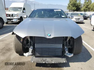 2024 BMW 5 Series 530i with VIN WBA43FJ06RCR20072, listed as a Copart auction lot 69864814 with 4,871 mi miles and Salvage Title. Bid and sale history available at carsss.com. Image 5.