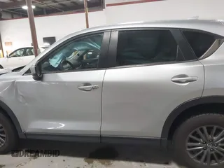 2020 Mazda CX-5 Touring with VIN JM3KFBCMXL0784653, listed as a IAAI auction lot 41817904 with 71,513 mi miles and . Bid and sale history available at carsss.com. Image 14.