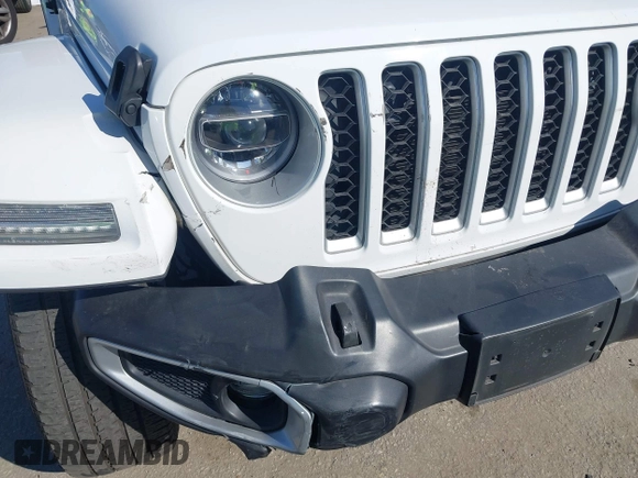 2021 Jeep Wrangler Unlimited Sahara z VIN 1C4JJXP6XMW765398, wystawiony jako IAAI lot #41592185 z przebiegiem 26 834 mil mil oraz . Historia ofert i sprzedaży dostępna na DreamBid. Obrazek 6.