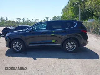 2019 Hyundai Santa Fe SE with VIN 5NMS23AD4KH088902, listed as a IAAI auction lot 42044465 with 34,302 mi miles and . Bid and sale history available at DreamBid. Image 14.
