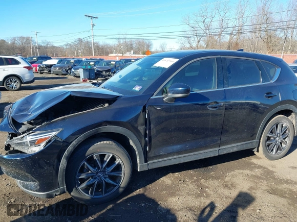 2017 Mazda CX-5 Grand Touring with VIN JM3KFBDL0H0104806, listed as a IAAI auction lot 41621964 with 60,728 mi miles. Bid and sale history available at carsss.com. Image 20.