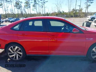 2019 Volkswagen Jetta GLI S z VIN 3VW5T7BU3KM225015, wystawiony jako IAAI lot #41352228 z przebiegiem 96 874 mil mil oraz . Historia ofert i sprzedaży dostępna na DreamBid. Obrazek 13.