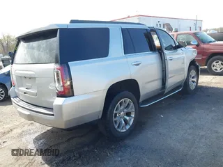 2015 GMC Yukon SLE with VIN 1GKS1AKC8FR540627, listed as a IAAI auction lot 42004023 with 128,195 mi miles. Bid and sale history available at carsss.com. Image 4.