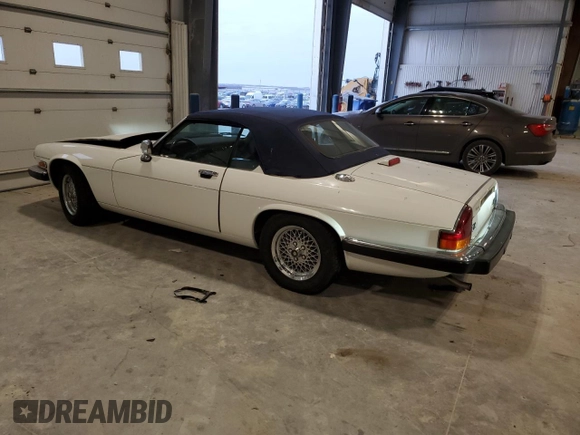 1989 Jaguar XJS z VIN SAJNV4847KC164497, wystawiony jako Copart lot #87258504 z przebiegiem 90 299 mil mil oraz Szkody całkowita. Historia ofert i sprzedaży dostępna na DreamBid. Obrazek 2.
