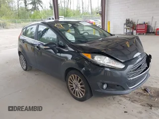 2014 Ford Fiesta Titanium z VIN 3FADP4FJ4EM228291, wystawiony jako IAAI lot #42146481 z przebiegiem 200 109 mil mil oraz . Historia ofert i sprzedaży dostępna na DreamBid. Obrazek 1.