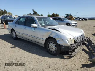 2000 Mercedes-Benz E-Class with VIN WDBJF65J4YB159268, listed as a Copart auction lot 50923115 with 127,650 mi miles and Salvage Title. Bid and sale history available at carsss.com. Image 4.
