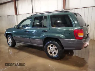 2000 Jeep Grand Cherokee Laredo with VIN 1J4GW48S2YC256123, listed as a Copart auction lot 56015855 with 147,549 mi miles and Salvage title. Bid and sale history available at DreamBid. Image 2.