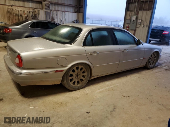 2004 Jaguar XJ with VIN SAJEA71C84SG07220, listed as a Copart auction lot 70916164 with 151,102 mi miles and Salvage Title. Bid and sale history available at carsss.com. Image 3.