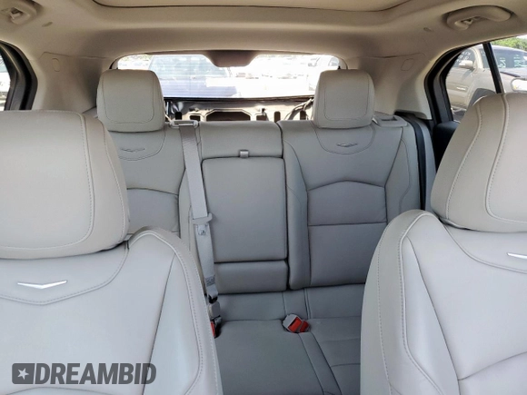 2023 Cadillac XT4 FWD Luxury z VIN 1GYAZAR42PF102696, wystawiony jako Copart lot #60524065 z przebiegiem 1 903 mil mil oraz Szkoda całkowita • Salvage title. Historia ofert i sprzedaży dostępna na DreamBid. Obrazek 10.