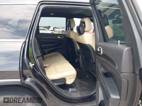 2014 Jeep Grand Cherokee Laredo with VIN 1C4RJFAG8EC440119, listed as a IAAI auction lot 42030855 with 179,392 mi miles and . Bid and sale history available at DreamBid. Image 8.