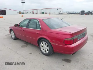 2001 Cadillac Seville z VIN 1G8KS54Y91U227846, wystawiony jako IAAI lot #42134095 z przebiegiem 216 766 mil mil oraz . Historia ofert i sprzedaży dostępna na DreamBid. Obrazek 3.