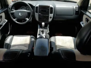 2005 Mercury Mariner Luxury z VIN 4M2CU57185DJ16120, wystawiony jako Copart lot #61803024 z przebiegiem 176 498 mil mil oraz Szkody całkowita. Historia ofert i sprzedaży dostępna na DreamBid. Obrazek 8.