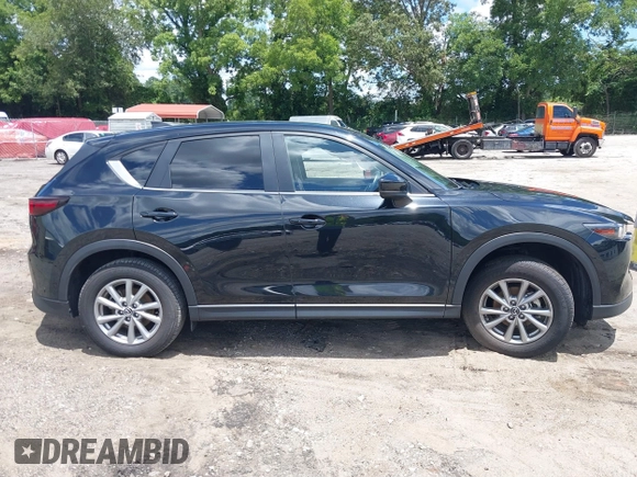 2023 Mazda CX-5 S Carbon Edition z VIN JM3KFBCMXP0201665, wystawiony jako IAAI lot #39965378 z przebiegiem 29 105 mil mil oraz . Historia ofert i sprzedaży dostępna na DreamBid. Obrazek 13.