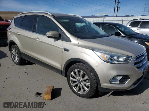 2017 Ford Escape Titanium with VIN 1FMCU9JD8HUE83650, listed as a Copart auction lot 48498245 with 103,920 mi miles and Salvage Title. Bid and sale history available at carsss.com. Image 4.