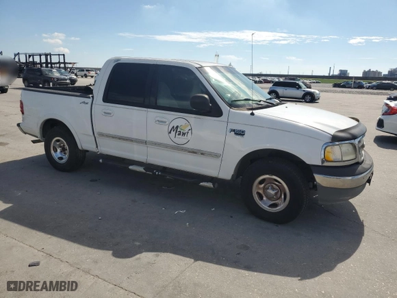 2001 Ford F-150 SuperCrew XLT with VIN 1FTRW07W41KE02772, listed as a Copart auction lot 73586724 with 0 mi miles and Salvage Title. Bid and sale history available at carsss.com. Image 4.