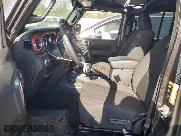 2023 Jeep Gladiator Rubicon с VIN 1C6JJTBGXPL574702, выставлен на аукционе Copart как лот 75914474 с пробегом 10 506 миль миль и Списание • Salvage title. История ставок и продаж доступна на DreamBid. Изображение 7.