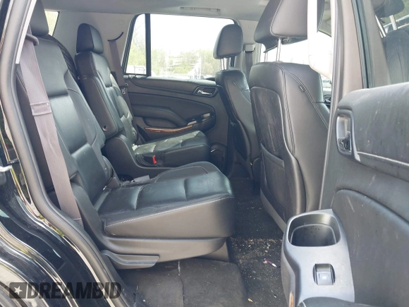 2015 Chevrolet Tahoe LTZ with VIN 1GNSKCKC8FR514671, listed as a IAAI auction lot 42157084 with 182,665 mi miles and . Bid and sale history available at DreamBid. Image 8.
